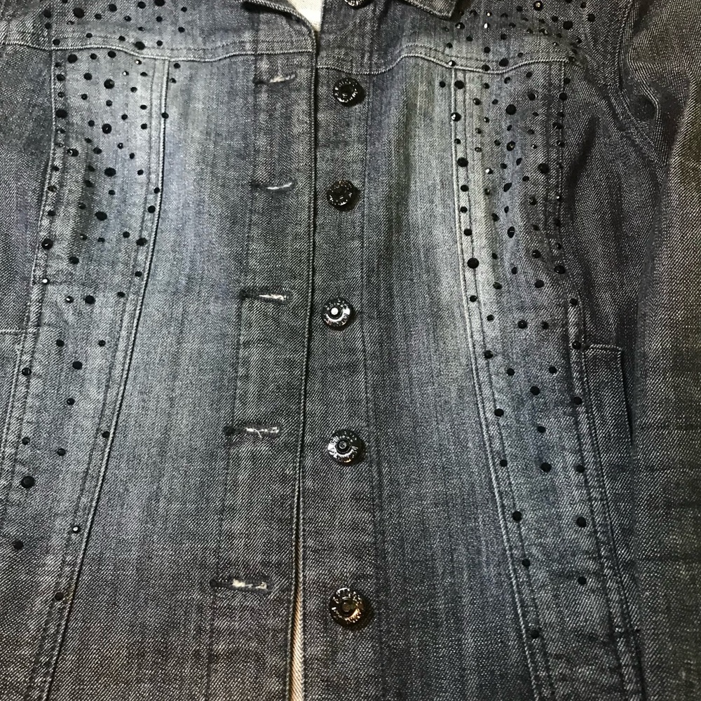 Denim jacket with black rhinestones front and back. Very good used condition.